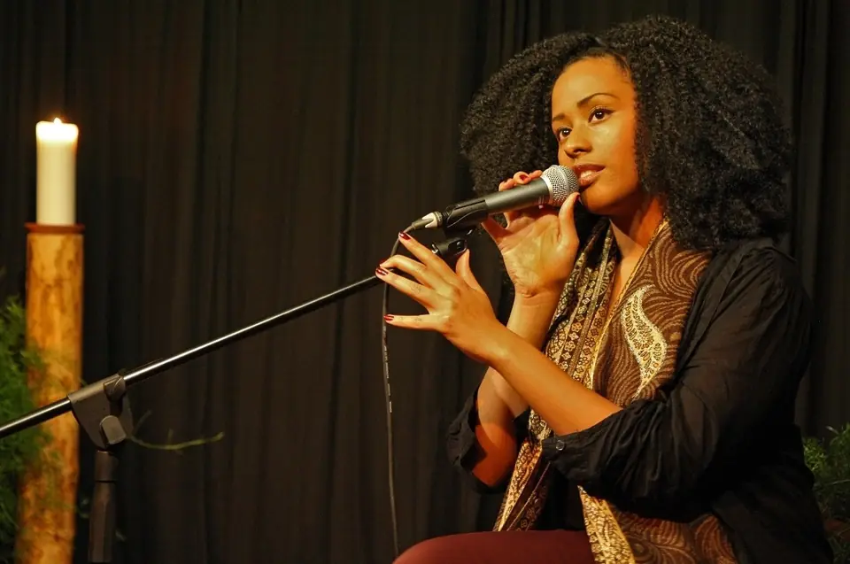 A singer performing at a microphone